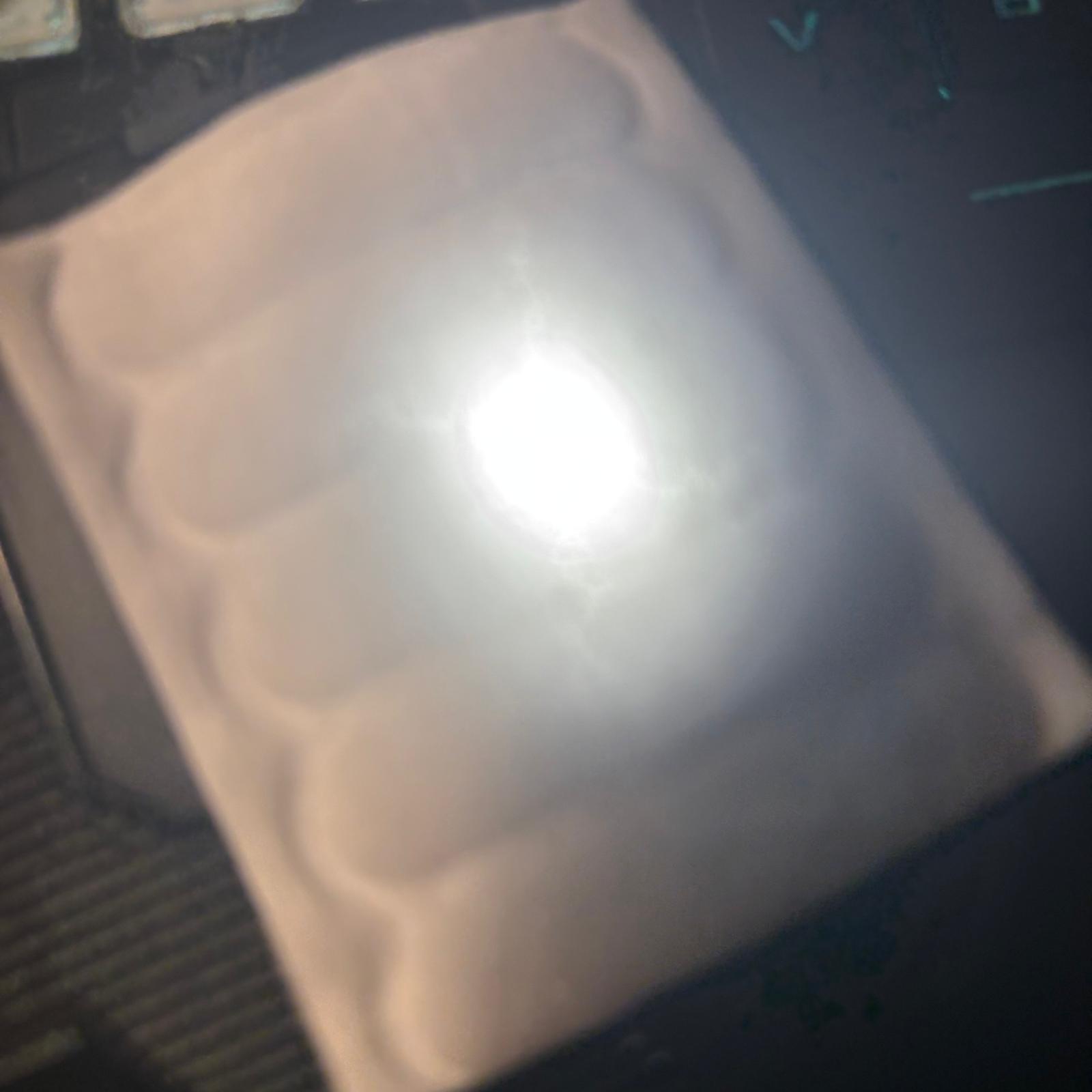 testing how light shines through cotton